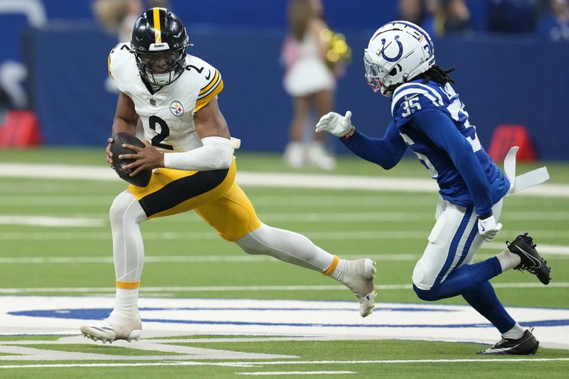 Pittsburgh Steelers quarterback Justin Fields (2) is chased out of the pocket by Indianapolis Colts cornerback Chris Lammons (35) during the second half of an NFL football game Sunday, Sept. 29, 2024, in Indianapolis. (AP Photo/Darron Cummings)