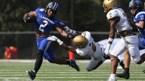 LaGrange running back Malachi Fannin (2) is tackled by Douglass defensive back Keonte Langford (6) During the first half of the Corky Kell Dave Hunter Classic at Kell High School, Wednesday, August 14, 2024, in Marietta, Ga. (Jason Getz / AJC)
