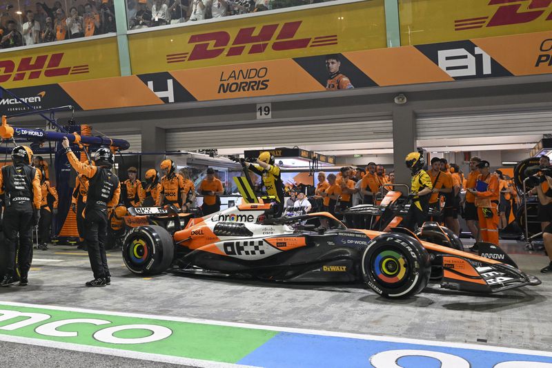 McLaren driver Lando Norris of Britain of leaves pit lane during the Singapore Formula One Grand Prix at the Marina Bay Street Circuit, in Singapore, Sunday, Sept. 22, 2024. (Mohd Rasfan/Pool Photo via AP)