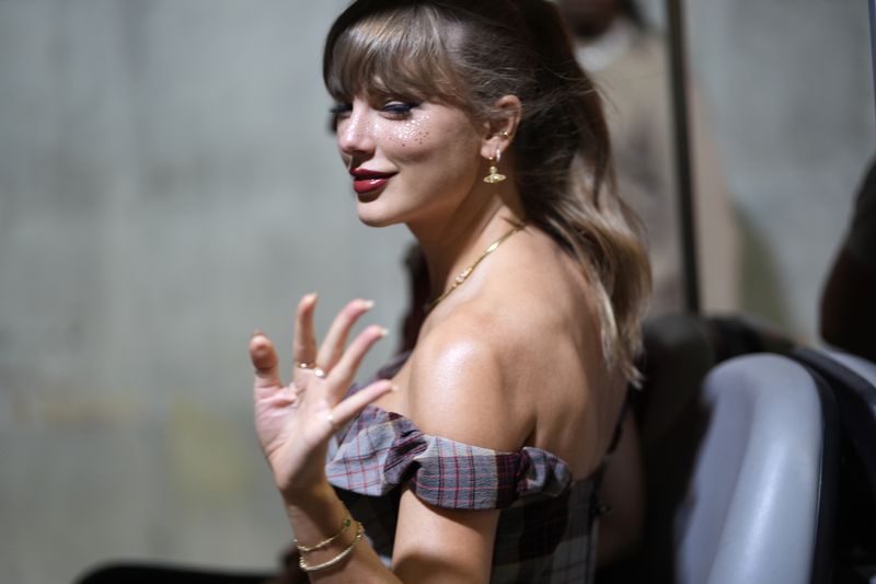 Taylor Swift arrives before the start of an NFL football game between the Kansas City Chiefs and the New Orleans Saints Monday, Oct. 7, 2024, in Kansas City, Mo. (AP Photo/Charlie Riedel)