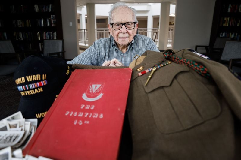 World War II veteran Alan Kinder with his mementos in Gainesville, Georgia, on Friday, May 24, 2024. “There were lucky breaks everywhere in my life," he said. (Natrice Miller/ AJC)