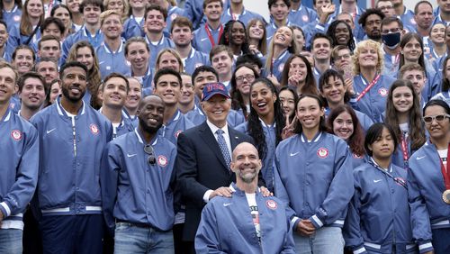 President Joe Biden, front row center, takes a photo with attendees at an event celebrating the 2024 U.S. Olympic and Paralympic teams on the South Lawn of the White House in Washington, Monday, Sept. 30, 2024. (AP Photo/Susan Walsh)