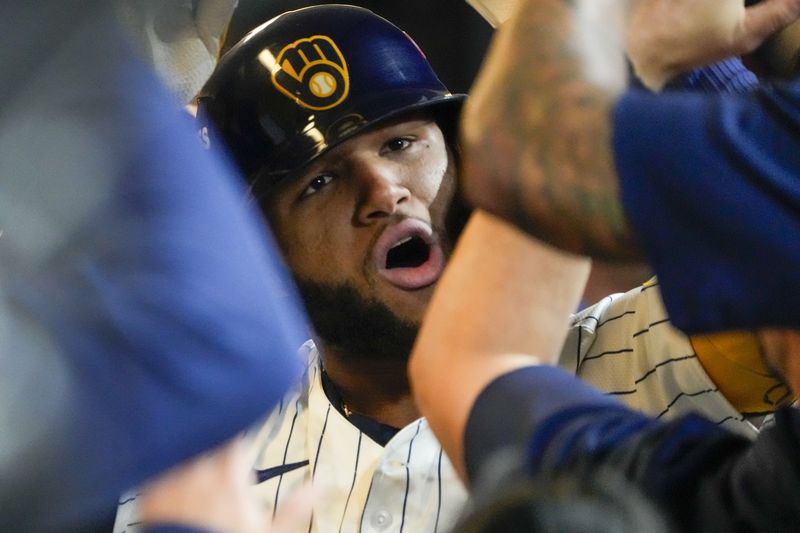 Milwaukee Brewers' Jackson Chourio is congratulated after hitting a home run during the eighth inning of Game 2 of a National League wild card baseball game against the New York Mets Wednesday, Oct. 2, 2024, in Milwaukee. (AP Photo/Morry Gash)