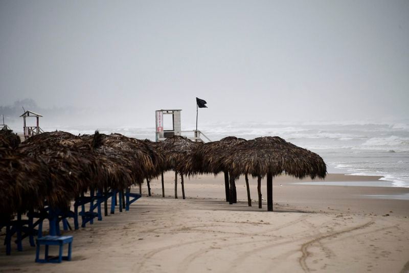 Palapas sit deserted on a beach in Miramar, in the southwestern Gulf of Mexico, Wednesday, June 19, 2024. Tropical Storm Alberto formed on Wednesday in the southwestern Gulf of Mexico, the first named storm of the hurricane season. (AP Photo/Fabian Melendez)