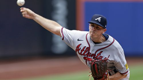 Atlanta Braves pitcher Allan Winans throws against the New York Mets during the fourth inning in the first baseball game of a doubleheader on Saturday, Aug. 12, 2023, in New York. (AP Photo/Adam Hunger)