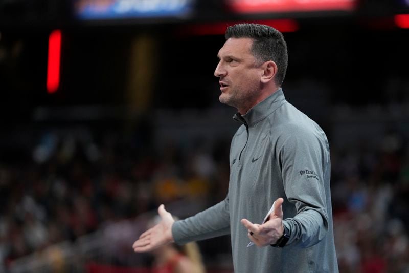 Phoenix Mercury head coach Nate Tibbetts argues a call during the first half of a WNBA basketball game against the Indiana Fever, Friday, Aug. 16, 2024, in Indianapolis. (AP Photo/Darron Cummings)