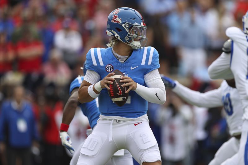 Mississippi quarterback Jaxson Dart (2) looks to throw the ball during the first half of an NCAA college football game against Kentucky Saturday, Sept. 28, 2024, in Oxford, Miss. (AP Photo/Randy J. Williams)