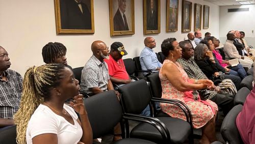 Sparta residents attend a Georgia Public Service Commission hearing on whether a railroad company can use eminent domain to condemn property in their community, Tuesday, Aug. 6, 2024, in Atlanta. (AP Photo/Charlotte Kramon)