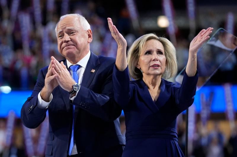 Democratic vice presidential nominee Minnesota Gov. Tim Walz and wife Gwen react during the Democratic National Convention Wednesday, Aug. 21, 2024, in Chicago. (AP Photo/Paul Sancya)