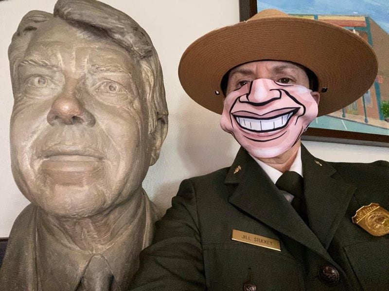 Jill Stuckey, superintendent of the Jimmy Carter National Historic Site wearing a Jimmy Carter mask in honor of his 96th birthday.