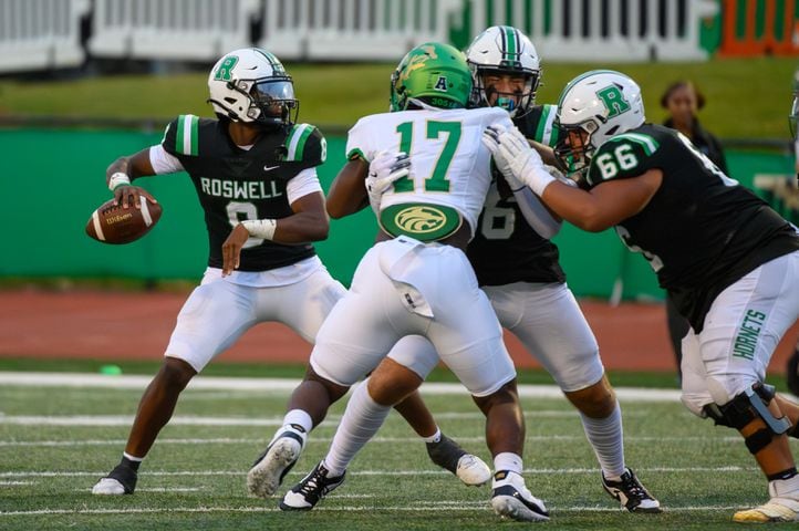 Roswell’s quarterback Trey Smith unleashes a pass.  (Jamie Spaar for the Atlanta Journal Constitution)