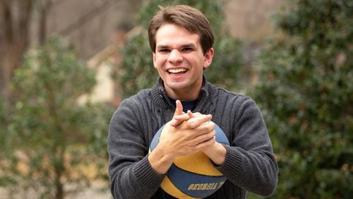 Evan Woody, 21, laughs as he plays basketball in the driveway of his home in Dunwoody, Ga. on Wednesday, Dec. 23, 2020. Evan is mentally and physically disabled as a result of a traumatic brain injury that occurred when he was a toddler. According to his parents, Phil and Lisa Woody, Evan has the mental equivalency of a three-year-old and is nonverbal. Since the start of the pandemic, Evan has undergone virtual learning for school, which his parents, Phil and Lisa Woody, say is ineffective. The Woodys say that Evan's hours of instruction have decreased from about 35 hours per week for normal in-person school to about 6.5 hours per week for virtual school, only 2 of which are one-on-one. Furthermore, he requires constant attention and supervision, which has been difficult for Phil and Lisa, who are both working full-time from home. They have estimated that they will need to save $2.8 million in order to provide for Evan throughout his life. While Evan has been approved for a Medicaid program (NOW/COMP Waiver), his parents say the program has never been fully funded by the state of Georgia, and Evan, with thousands of other disabled Georgians, will remain on the waitlist indefinitely. (Casey Sykes for The Atlanta Journal-Constitution)