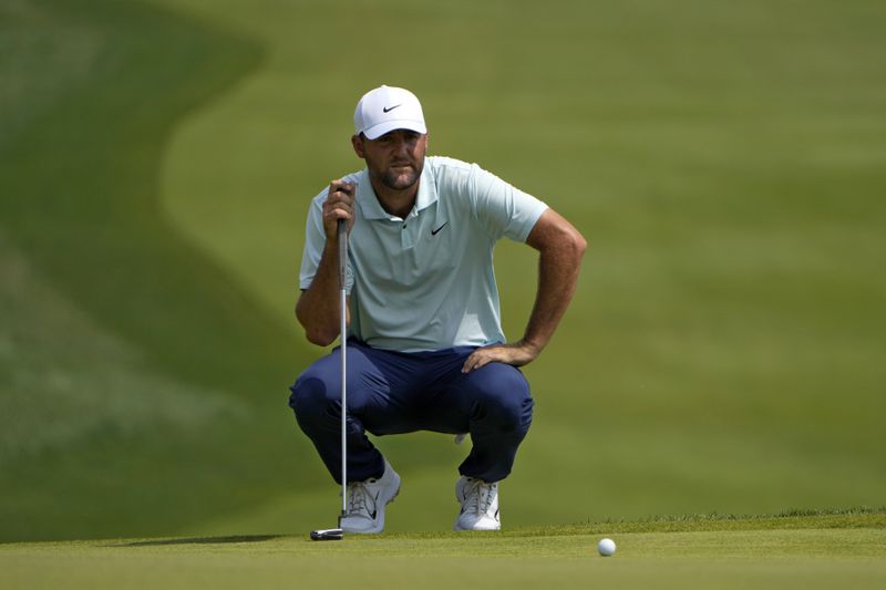 Scottie Scheffler lines up a putt on the first hole during the first round of the Travelers Championship golf tournament at TPC River Highlands, Thursday, June 20, 2024, in Cromwell, Conn. (AP Photo/Seth Wenig)