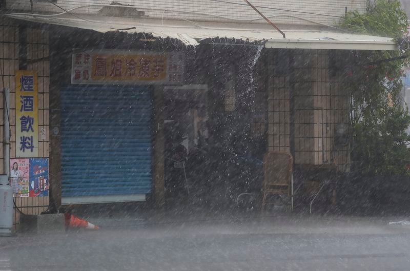 Wind and rain blow through Kaohsiung, southern Taiwan, as Typhoon Krathon arrives Thursday, Oct. 3, 2024. (AP Photo/Chiang Ying-ying)