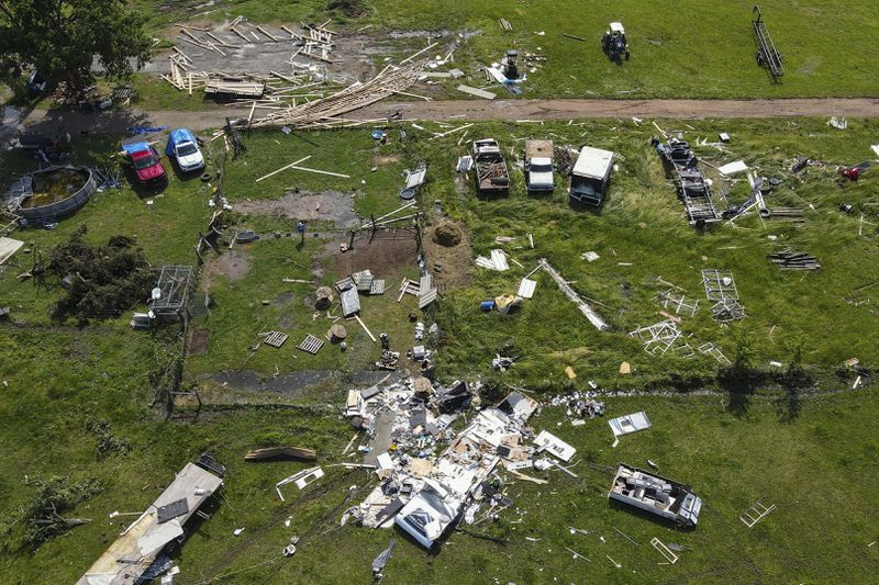 Damage is seen after a storm the night before, Sunday, May 26, 2024, in Pryor, Okla. (Mike Simons/Tulsa World via AP)