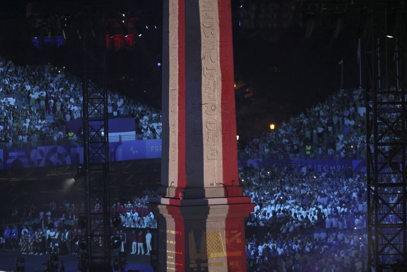 The Obelisk of La Concorde plaza bears the colors of the French flag during the Opening Ceremony for the 2024 Paralympics, Wednesday, Aug. 28, 2024, in Paris, France. (AP Photo/Thomas Padilla)