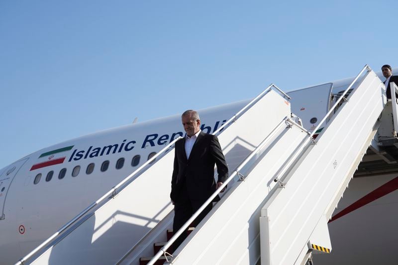 Iranian President Masoud Pezeshkian arrives at the Baghdad International Airport in Baghdad, Iraq, Wednesday Sept. 11, 2024. (Murtadha Al-Sudani/Pool Photo via AP)