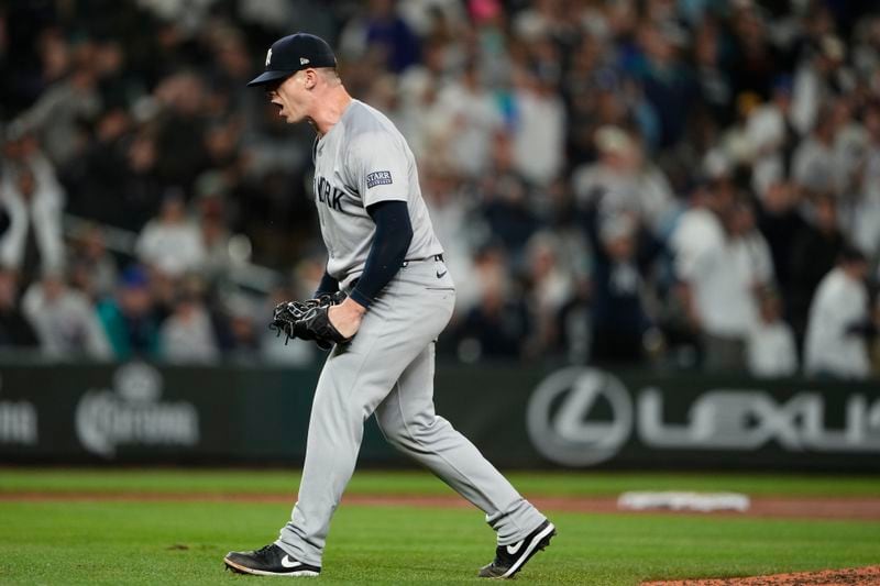 New York Yankees relief pitcher Ian Hamilton reacts to earning the save in a 2-1 win over the Seattle Mariners in a baseball game Wednesday, Sept. 18, 2024, in Seattle. (AP Photo/Lindsey Wasson)