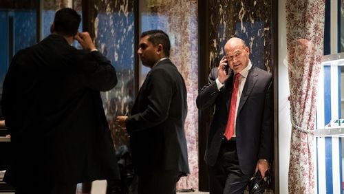 Gary Cohn, president and chief operating officer at Goldman Sachs, talks on his phone as he arrives at Trump Tower, November 29, 2016 in New York City. President-elect Donald Trump and his transition team are in the process of filling cabinet and other high level positions for the new administration.