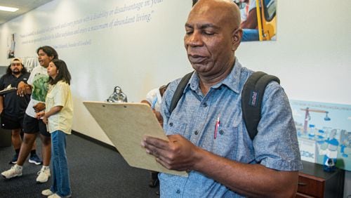 Kirkland McIntosh fills out a job application form at a job fair hosted by Goodwill Career Center in Atlanta in July. (Ziyu Julian Zhu/AJC)