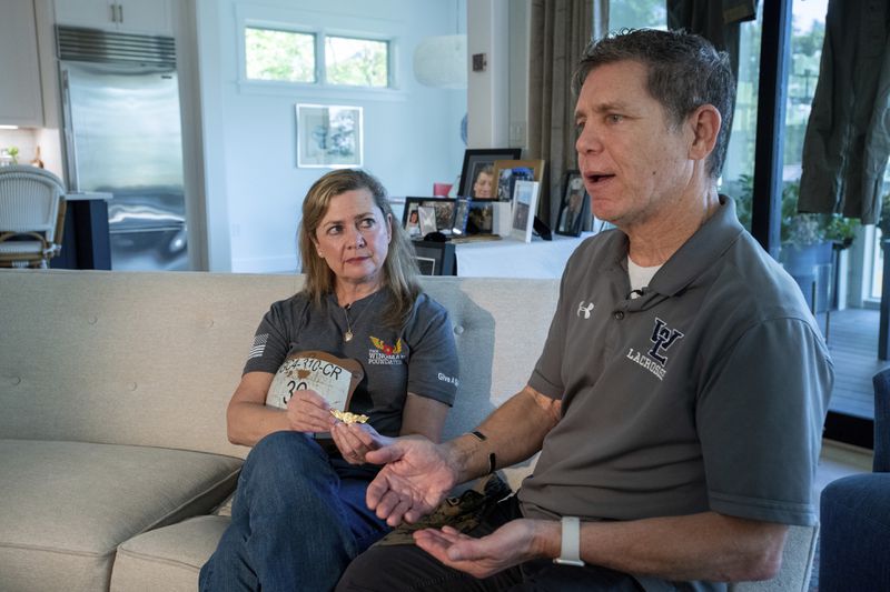 Bart Collart, right, and his wife Alexia Collart, talk about their son, Marine Corporal Spencer R. Collart, at their home, in Arlington, Va., Thursday, June 19, 2024. Their son was killed along with two other Marines when the MV-22B Osprey aircraft they were on crashed during drills on a north Australian island on August 27, 2023. (AP Photo/Rod Lamkey, Jr.)