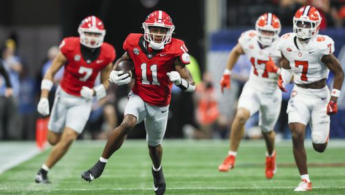 Georgia wide receiver Arian Smith (11) runs for a large gain after a catch during the second half against Clemson at Mercedes-Benz Stadium, on Saturday, Aug. 31, 2024, in Atlanta. Georgia won 34-3. (Jason Getz / AJC)
