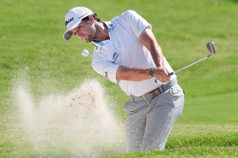 Davis Riley hits from the sand on the 18th hole during the final round of the Charles Schwab Challenge golf tournament at Colonial Country Club in Fort Worth, Texas, Sunday, May 26, 2024. (AP Photo/LM Otero