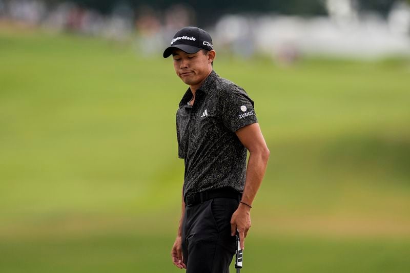 Collin Morikawa reacts to his chip up to the 18th green during the final round of the Tour Championship golf tournament, Sunday, Sept. 1, 2024, in Atlanta. (AP Photo/Mike Stewart)