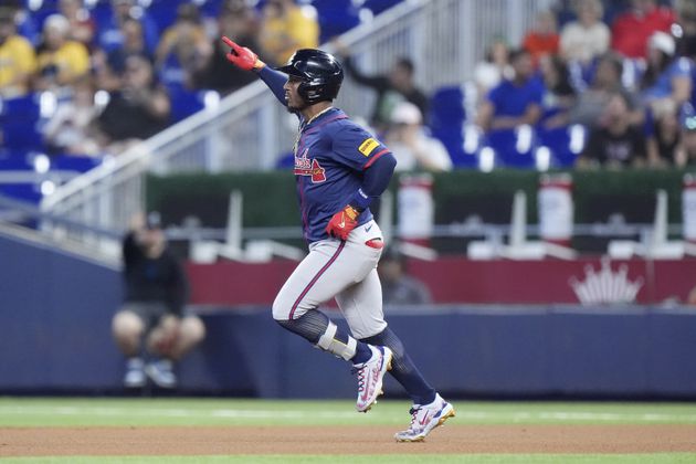 Atlanta Braves' Ozzi Albies heads to second base as he hits a home run during the first inning of a baseball game against the Miami Marlins, Sunday, Sept. 22, 2024, in Miami. (AP Photo/Wilfredo Lee)