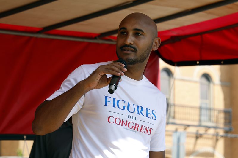 Alabama's new 2nd Congressional District Democratic candidate Shomari Figures speaks during the Macon County Day Festival in Tuskegee, Ala., on Saturday, Aug 31, 2024. (AP Photo/ Butch Dill)