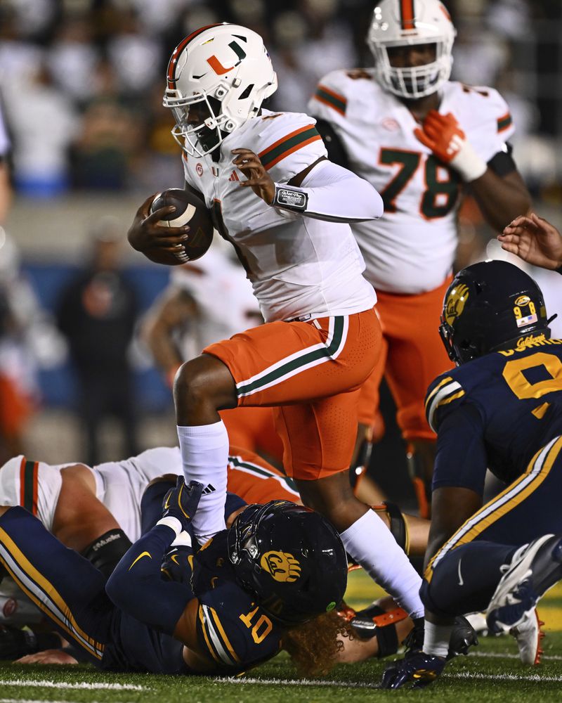 California linebacker Teddye Buchanan (10) sacks Miami quarterback Cam Ward (1) during the first quarter of their game at Memorial Stadium in Berkeley, Calif., on Saturday, Oct. 5, 2024. (Jose Carlos Fajardo/Bay Area News Group via AP)