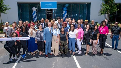 Gov. Brian Kemp (center) posed with Clayton County officials and GlassesUSA officials at a ribbon-cutting ceremony on May 30, 2024.