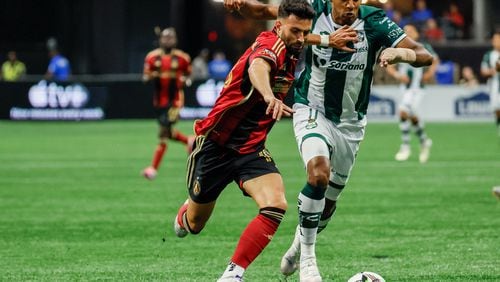 Atlanta United midfielder Pedro Amador (18) battles for posetion against Santos Laguna forward Antony Lozano (11) during the first half at Mercedes-Benz Stadium on Sunday, August 4, 2024, in Atlanta.

(Miguel Martinez/ AJC)