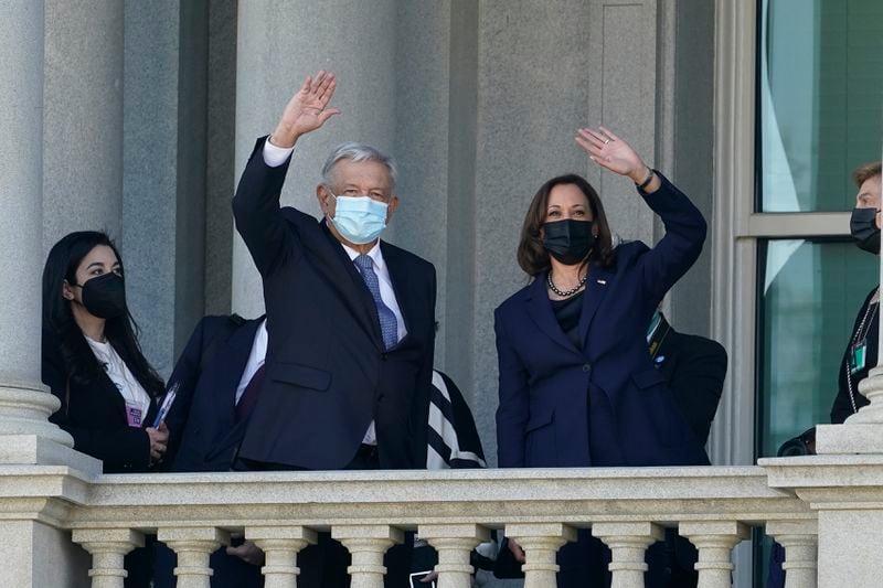 FILE - Vice President Kamala Harris and Mexican President Andrés Manuel López Obrador wave from the balcony of the Eisenhower Executive Office Building on the White House complex in Washington, Thursday, Nov. 18, 2021. (AP Photo/Susan Walsh, File)