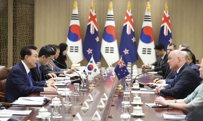 South Korean President Yoon Suk Yeol, left, talks with New Zealand's Prime Minister Christopher Luxon, right, during a meeting at the Presidential Office in Seoul, South Korea, Wednesday, Sept. 4, 2024. (Jin Sung-chul/Yonhap via AP)