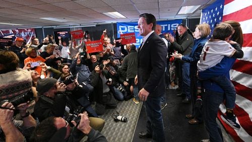 Republican presidential candidate Florida Gov. Ron DeSantis reacts as he takes on the stage during a campaign event, Saturday, January 13, 2024, in West Des Moines, Iowa. (Hyosub Shin / Hyosub.Shin@ajc.com)