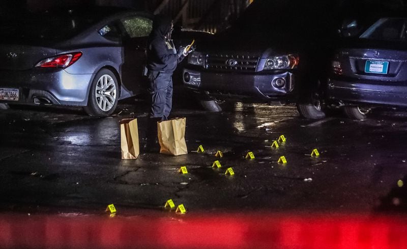 At least 60 evidence markers where scattered across the complex’s parking lot. The crime scene spanned the length of two apartment buildings.