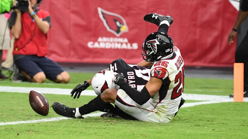 Cardinals' Damiere Byrd loses the ball while being tackled by the Falcons' Isaiah Oliver Oct. 13, 2019, at State Farm Stadium in Glendale, Ariz. The ball rolled into the end zone but was ruled down by contact.