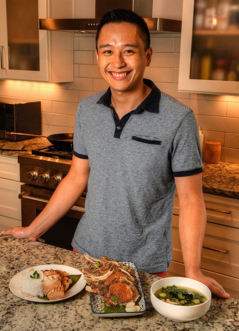 Mike Pimentel, founder of Filipino pop-up Adobo ATL, is shown at his Decatur home with his Filipino recipes: (from left) Bistek na Isda (sauteed cod with onions), Fried Adobo Pork Chops and Suam Na Mais (a Filipino corn soup). Styling by Mike Pimentel / Chris Hunt for The Atlanta Journal-Constitution