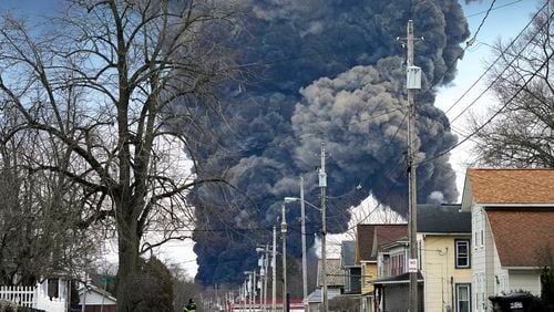 FILE - A black plume rises over East Palestine, Ohio, as a result of the controlled detonation of a portion of the derailed Norfolk Southern trains Monday, Feb. 6, 2023. Days before the National Transportation Safety Board is set to explain why first responders were wrong to blow open five tank cars and burn the toxic chemical inside after the East Palestine derailment, Norfolk Southern said Friday, June 21, 2024 it plans to lead an industrywide effort to improve the way those decisions are made.(AP Photo/Gene J. Puskar, File)