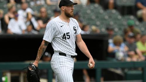 Chicago White Sox starting pitcher Garrett Crochet reacts after giving up a two-run home run to Seattle Mariners' Cal Raleigh during the first inning of a baseball game in Chicago, Sunday, July 28, 2024. (AP Photo/Paul Beaty)