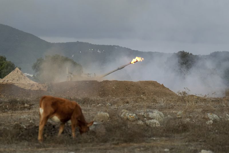 An Israeli mobile artillery unit fires a shell from northern Israel towards Lebanon, Wednesday, Oct. 2, 2024. (AP Photo/Baz Ratner)