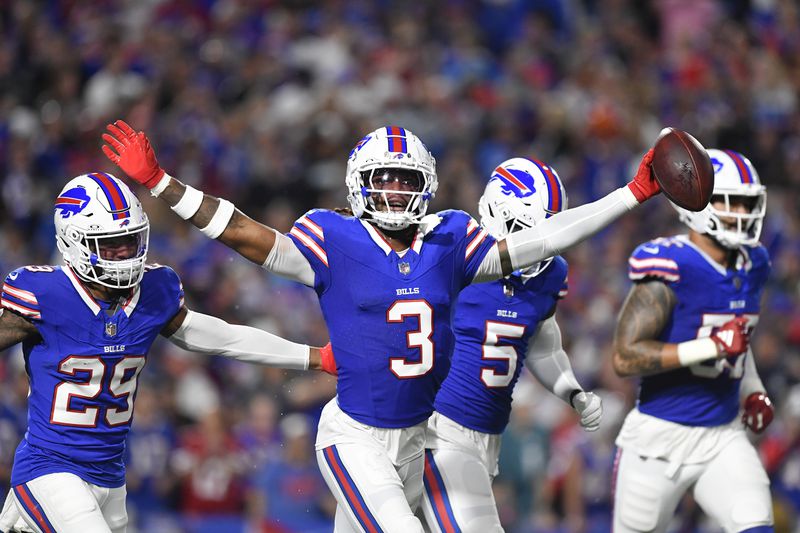 Buffalo Bills safety Damar Hamlin (3) celebrates after intercepting a pass during the first half of an NFL football game against the Jacksonville Jaguars, Monday, Sept. 23, 2024, in Orchard Park, NY. (AP Photo/Adrian Kraus)