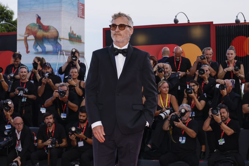 Joaquin Phoenix poses for photographers upon arrival for the premiere of the film 'Joker: Folie A Deux' during the 81st edition of the Venice Film Festival in Venice, Italy, on Wednesday, Sept. 4, 2024. (Photo by Joel C Ryan/Invision/AP)