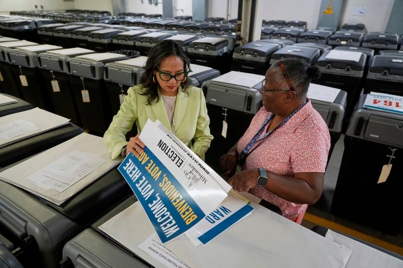 Milwaukee's election administrator Paulina Gutierrez, left, talks to Phyllis Whitley, Monday, Sept. 16, 2024, in the city's election operation center in Milwaukee. (AP Photo/Morry Gash)