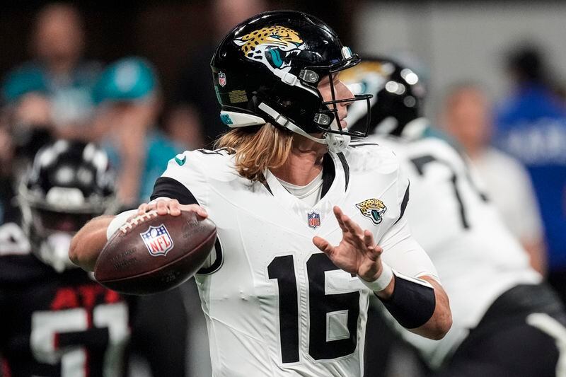 Jacksonville Jaguars quarterback Trevor Lawrence (16) works against the Atlanta Falcons in the first half of an NFL preseason footballl game, Friday, Aug. 23, 2024, in Atlanta. (AP Photo/John Bazemore)