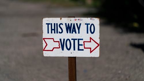 FILE - A sign stands outside a polling place during the Republican primary election in Wilson, Wyo., on Aug. 16, 2022. (AP Photo/Jae C. Hong, File)