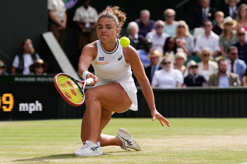 Jasmine Paolini of Italy plays a forehand return to Donna Vekic of Croatia during their semifinal match at the Wimbledon tennis championships in London, Thursday, July 11, 2024. (AP Photo/Alberto Pezzali)