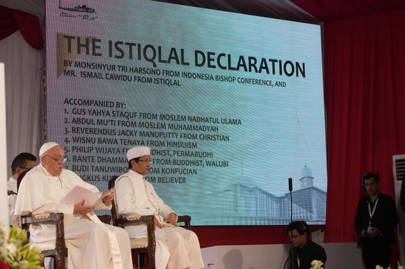 The Grand Imam Nasaruddin Umar, right, listen to Pope Francis, after signing the "Joint Declaration of Istiqlal 2024" at the Istiqlal Mosque in Jakarta, Thursday, Sept. 5, 2024. Pope Francis urged Indonesia to live up to its promise of "harmony in diversity" and fight religious intolerance on Wednesday, as he set a rigorous pace for an 11-day, four-nation trip through tropical Southeast Asia and Oceania. (AP Photo/Gregorio Borgia)