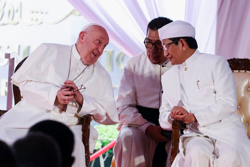 Pope Francis, left, and the grand imam of Istiqlal Mosque Nasaruddin Umar, right, attend an interreligious meeting at the Istiqlal Mosque in Jakarta, Thursday, Sept. 5, 2024. (Ajeng Dinar Ulfiana/Pool Photo via AP)